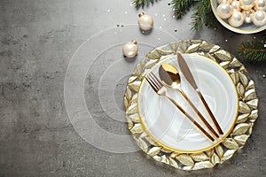 Christmas table setting on grey background. Space for text