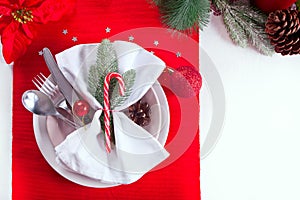 Christmas table setting with holiday decorations. Top view