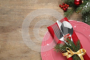 Christmas table setting on wooden background. Space for text