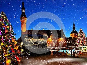 Christmas Tallinn Old  Town Hall Square Winter night marketplace and  tree light decoration ,  holiday celebration in Europe  blur