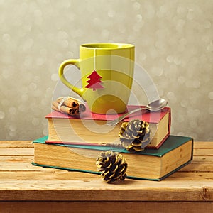 Christmas tea mug on books with decorations