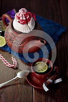 Christmas teapot with the red santa hat on it.