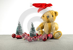 Christmas teddy with tree and balls photo