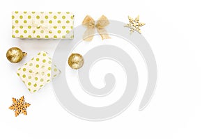 Christmas Texture made of gold decorations on white background with empty copy space for text. Holiday and celebration