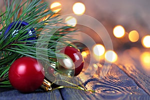Christmas theme. Red and gold christmas balls. Blure background. Christmas background. Pine branch
