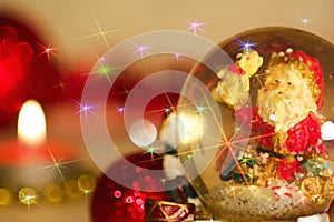 Christmas themed background with Santa Claus, red balls and red glitter photo