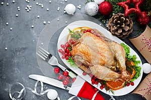 Christmas themed dinner table roasted chicken and christmas decoration