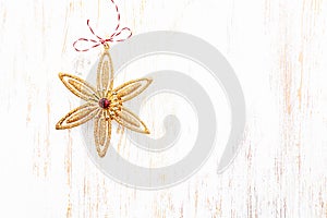 Christmas Time. Christmas star on white wooden background.