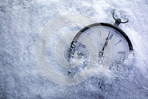 Christmas Time Clock under snow, countdown to midnight