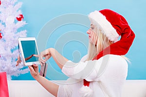 Girl with tablet credit card doing online shopping