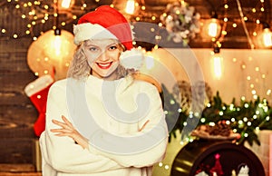 Christmas time. happy new year. christmas preparation. girl in red santa claus hat. Cheerful woman. In sweater. winter