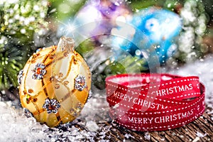 Christmas Time. Luxury golden purple blue christmas ball and decoration.Red ribbon with text happy christmas