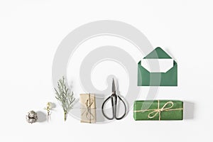 Christmas time. Presents, letter and branch on white background.