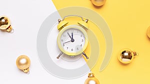 New year clock 2022. Retro style yellow clock in happy Christmas midnight. Countdown to happy xmas on yellow background