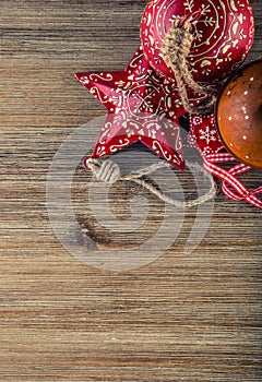 Christmas time. Wrought metal plate filled with various Christmas decorations. Christmas stars, Jingle bells in various positions.