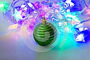 Christmas toy decoration on a background of multicolored lights
