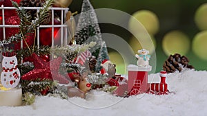 Christmas toy on fake snow. Winter season and holiday decoration background