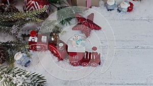 Christmas toy on fake snow. Winter season and holiday decoration background