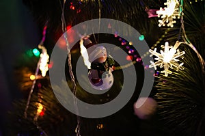 Christmas toy snowman in a red hat.