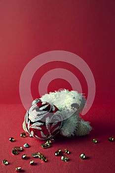 Christmas toys and bear on red background