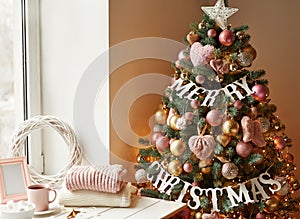 Christmas toys and decorations background. Christmas tree. Decorated New Year`s tree on blurred, sparkling and fairy background. N