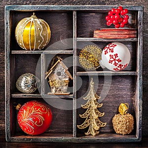 Christmas toys and decorations in a vintage wooden tray