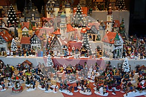 Christmas toys, gifts for young and old, Christmas village with houses and people