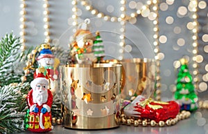 Christmas toys with golden lanterns and defocused lights