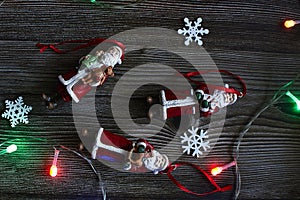 Christmas toys Santa Claus, wooden background garland, three toys on christmas tree new year christmas