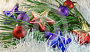 Christmas Toys stars and balls on white decoration with branch of pine tree