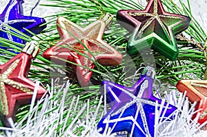 Christmas Toys stars on white decoration with branch of pine tree