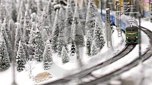 Christmas train toy goes through fantastic winter forest in slow motion. 3840x2160