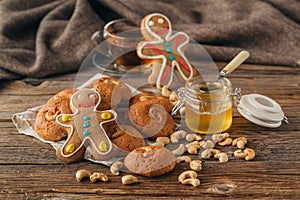 Christmas treats on plate and cup of tea on plaid close-up