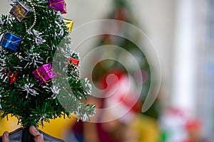 Christmas tree with background Caucasia woman celebrating holiday festival traditonal with Christmas tree and gift box with friend