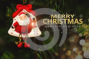 Christmas tree background and Christmas decorations with blurred, sparking, glowing and text Merry Christmas and Happy New Year