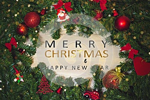 Christmas tree background and Christmas decorations with blurred, sparking, glowing and text Merry Christmas and Happy New Year