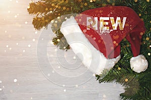 Christmas tree background and Christmas decorations with blurred, sparking, glowing and text Merry Christmas and Happy New Year