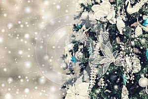 Christmas tree background and Christmas decorations with snow, blurred, sparking, glowing.