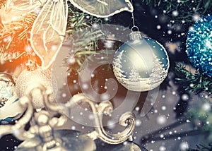 Christmas tree background and Christmas decorations with snow, blurred, sparking, glowing