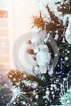 Christmas tree background and Christmas decorations with snow, blurred, sparking, glowing.