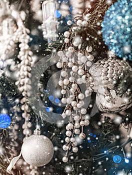 Christmas tree background and Christmas decorations with snow, blurred, sparking, glowing.