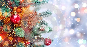 Christmas tree background and Christmas decorations with snow, blurred, sparking, glowing. Happy New Year and Xmas