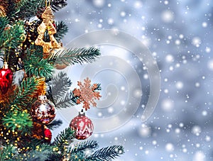 Christmas tree background and Christmas decorations with snow, blurred, sparking, glowing. Happy New Year and Xmas