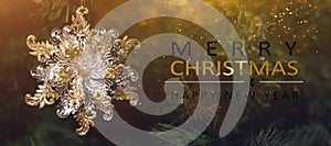 Christmas tree background and Christmas decorations with blurred, sparking, glowing and text Merry Christmas and Happy New Year