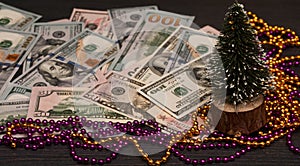 Christmas tree on the background of money. New Year`s presentation.