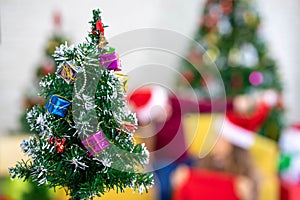 Christmas tree with backgroundCaucasian woman celebrating holiday festival traditonal with Christmas tree and gift box with friend