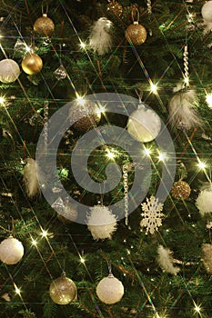 Christmas tree backgrounf of white and golden decorations photo