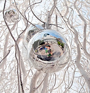 Christmas tree balls and mirroring of father and sun