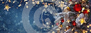 Christmas tree with baubles in a blue night - decorations on fir branches with shiny and defocused lights