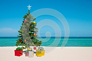 Christmas Tree on the beach. Merry Christmas. Present gift box. Happy New Year. Winter Holidays. Miami Florida vacation